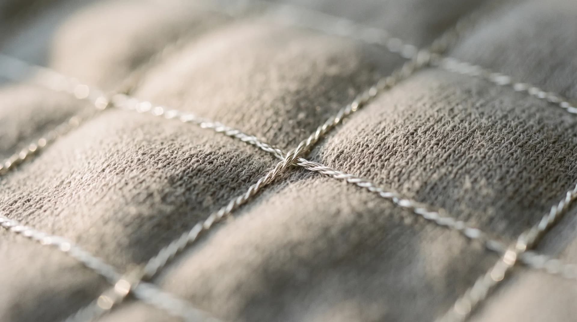 Macro of the bamboo weave with a silver thread crossing